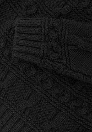 Sort strikket sweater med teksturerede kabelmønstre, ribbede manchetter og et chunky strikdesign. Blødt uldmateriale med en tykkere fornemmelse.