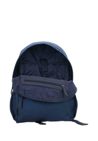 Navy blue backpack with a rounded shape, featuring a front zippered pocket and a top flap. Made from durable fabric with a smooth texture.