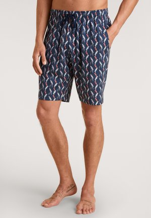 Marine zwemshorts met een herhalend patroon van witte en rode silhouetten. Gemaakt van lichtgewicht stof met een elastische tailleband en koord.