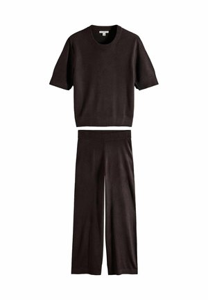 Black short-sleeve knit top and matching wide-leg pants laid flat on a white background.