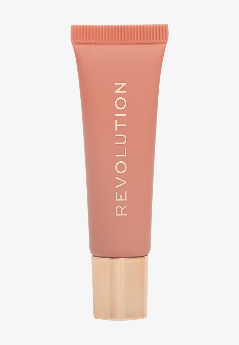 Revolution flytende rødme i en myk ferskenfarget tube med ribbet hette. Den har en klar gullfarget bunn og fremtredende hvit skrift på forsiden.