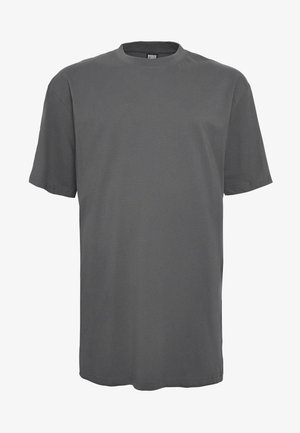 Pelēks īsām piedurknēm T-krekls, izgatavots no mīksta kokvilnas auduma. Tam ir noapaļots kakla izgriezums un brīvs piegriezums ar taisnu apakšmalu.