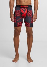 Boxers noirs et rouges à motifs avec des designs de damiers et un logo Playboy bien en évidence, fabriqués en tissu extensible avec une taille élastique.