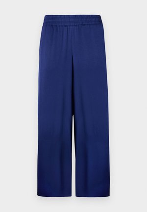 Marineblaue weite Hose mit elastischem Bund, aus glattem Stoff gefertigt, mit einem schlichten und funktionalen Design ohne sichtbare Muster.