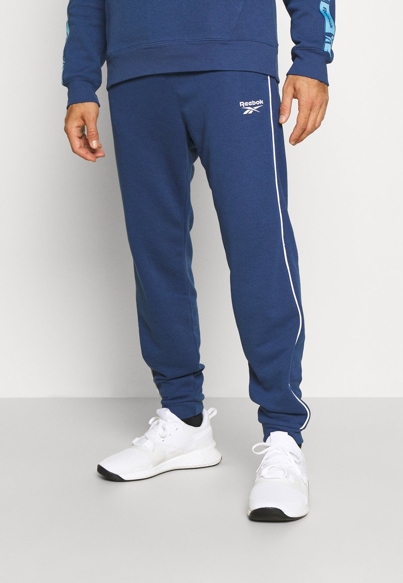 Reebok PIPING JOGGER - Calças de fato de treino - batik blue