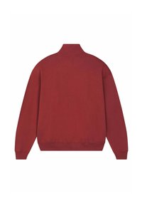 Felpa rossa con collo alto, polsini e orlo a coste. Realizzata in un tessuto morbido e strutturato di colore uniforme.