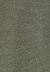 Olive green stretch fabric with a fine ribbed texture, displaying a consistent pattern. Lightweight and smooth, suitable for various garments.