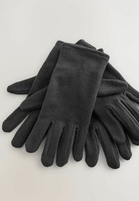 Ein Paar schwarze Fleece-Handschuhe mit einer weichen Textur, flach ausgelegt und überlappend auf einer schlichten hellen Fläche.