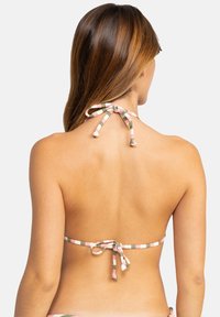 Multicolored halter bikini top with a tie-back design, featuring a textured, patterned fabric in pink, green, and white stripes.