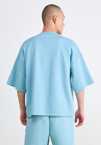 Nike Sportswear TECH FLEECE - Pamata T-krekls - denim turquoise