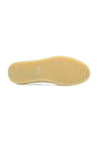 Suola in gomma con una superficie testurizzata e antiscivolo, caratterizzata da un motivo distintivo e di colore beige neutro. Marchio impresso vicino al tallone.