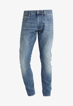 Verblasste blaue Slim-Fit-Jeans mit Knopf- und Reißverschluss, vorderen und hinteren Taschen sowie dezenten Waschungseffekten.