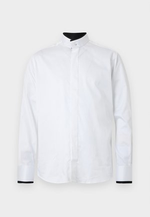 Weißes langärmliges Hemd mit Stehkragen, ausgestattet mit kontrastierenden schwarzen Akzenten an den Manschetten. Hergestellt aus glattem Stoff und im minimalistischen Stil gestaltet.