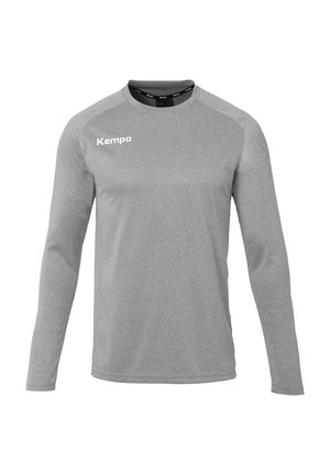 Long-sleeve gray sports shirt made of breathable fabric, featuring a round collar and the "Kempa" logo in white on the left chest.