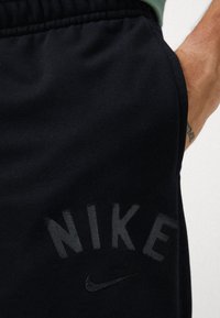 Nike Performance JOGGER - Tepláky - black/white