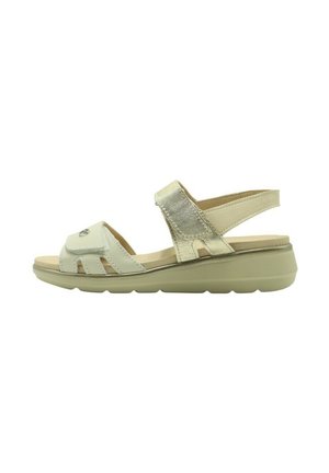 Sandalias para mujer con una correa metálica de color oro claro, parte superior de cuero crema, plantilla acolchada, cierre ajustable de Velcro y suela acolchada.