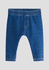 Leggins din denim albastru cu talie elastică, având un design de cusătură pentru buzunar frontal fals și o textură subtilă, potrivite pentru purtarea casual.