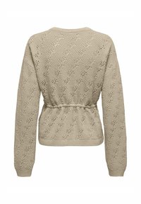 Beežist kootud kampsun keeruka avatud töömustriga, lõdva lõikega, pikad varrukad ja elastse vöökohaga, mis tekitab kogutud välimuse.