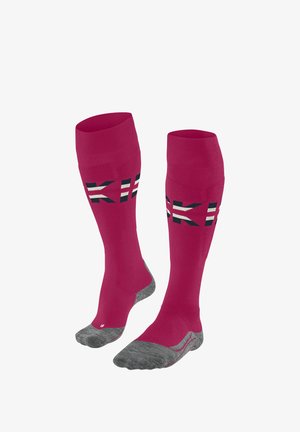 Calze rosa a ginocchio alto con suole grigie textured, dotate di accenti grafici in bianco e nero sulla parte superiore. Realizzate in un materiale liscio e elasticizzato.