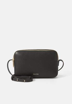 LOGO ELONGATED CAMERA BAG - Cross body bag - black/toasted coconut