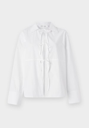 Witte langemouwen shirt van gladde stof met een button-down kraag, een sluiting met een strik aan de voorkant en manchetten. Eenvoudig en strak ontwerp.