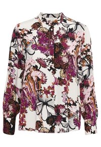 Blusa de manga larga con cuello de banda, presenta un estampado floral en púrpura, rosa y negro sobre un fondo blanco. Tela liviana, cierre de botones.