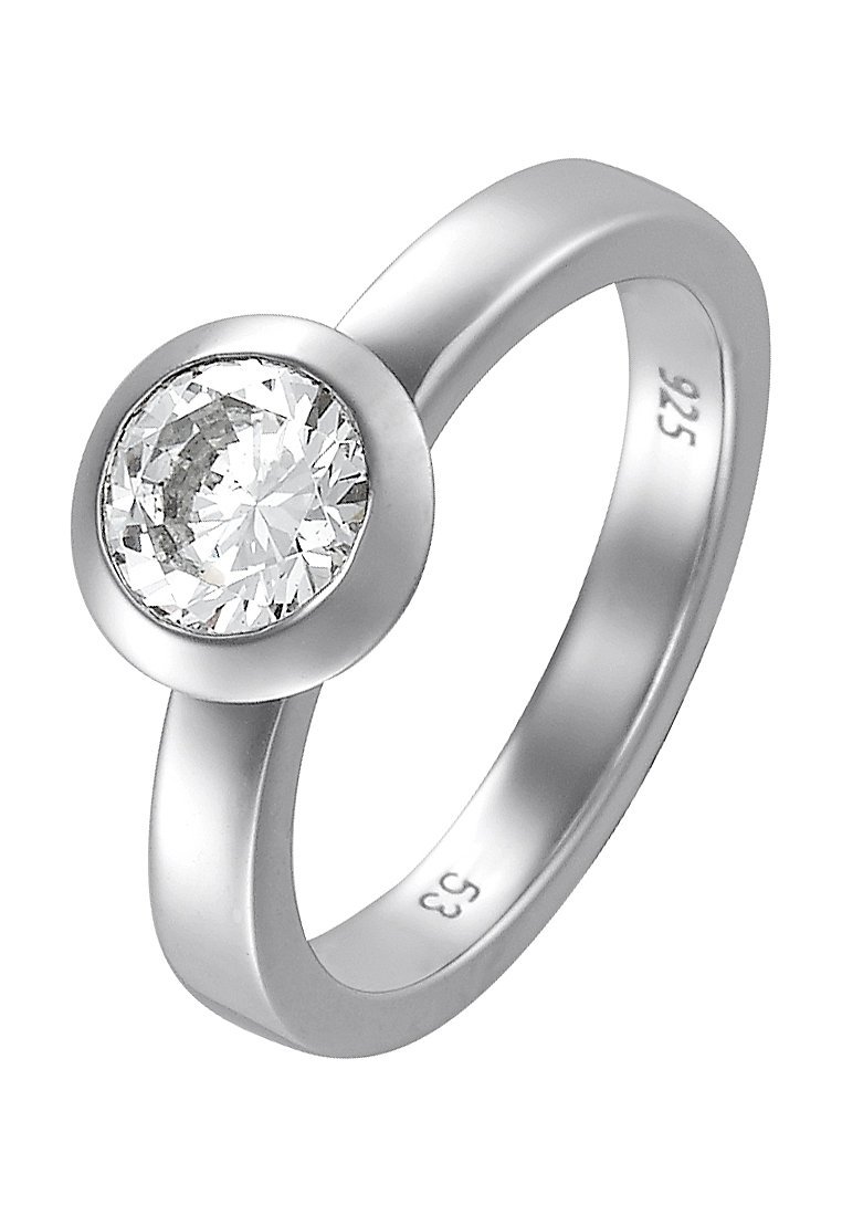 Anello in argento sterling con una pietra preziosa chiara, rotonda e sfaccettata, montata in una finitura liscia. Design minimalista con una finitura lucida.
