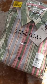 Striped button-up shirt in green, white, red, and pink. Packaged, featuring a collar, with tags visible and two dark buttons.