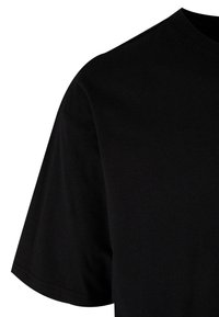 Sort T-shirt med korte ærmer, lavet af glat bomuldsstof. Har en rund halsudskæring og en afslappet pasform.