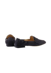 Navy blue suede loafers with a flat heel, featuring a rounded toe and a decorative flap across the front. Smooth texture throughout.