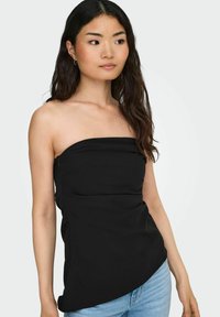 Must mustriba, millel on tihe disain, kõver põhjaja ja külgedel lukkude detail. Sujuv kangastekstuuri, lihtne ja modernne siluett.