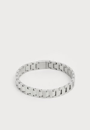 Silver metal bracelet with interlocking links, featuring a smooth, polished surface and a secure clasp for easy wear.