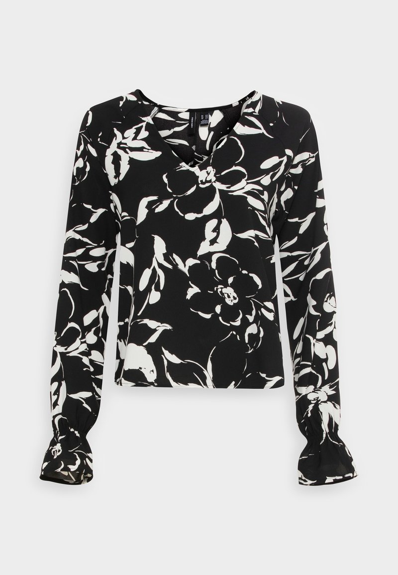 Blouse noire avec un motif floral blanc, décolleté en V, manches longues avec des poignets froncés, tissu lisse et coupe décontractée.