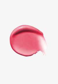 Macchia di rossetto rosa lucido con texture liscia su sfondo bianco.