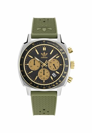 Montre chronographe avec un cadran noir, des accents dorés, un boîtier en acier inoxydable argenté et un bracelet en caoutchouc vert avec un motif texturé.