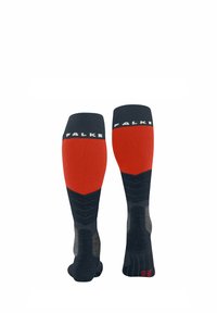 Calze fino al ginocchio di colore blu navy con una parte superiore rossa e una parte inferiore grigia testurizzata, con il nome del marchio "Falke" sul polsino.