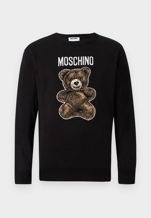 Pull noir à manches longues avec un motif d'ours en peluche marron et le mot « MOSCHINO » imprimé au-dessus de l'ours sur la poitrine.
