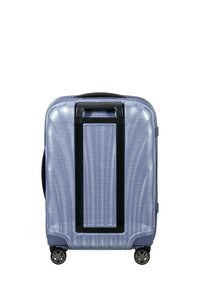 Hard-shell suitcase in light blue with a textured finish, black handle, and four sturdy wheels for mobility. Compact rectangular shape.