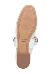 Suela de zapato blanca con fondo de goma texturizada, con una incrustación lisa en color tostado y un acento circular plateado. Nombre de la marca "WITTCHEN" grabado.