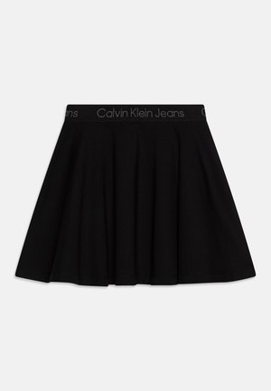 Gonna nera in cotone con design a campana e cintura elastica. Presenta il logo "Calvin Klein Jeans" sulla cintura. Texture liscia.