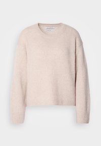Pull en laine beige à col rond, manches longues, poignets et ourlet côtelés, présenté sur un fond clair uni.