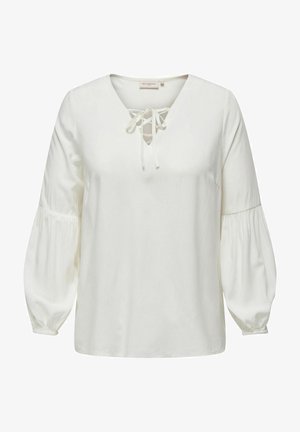 Fehér, hosszúujjú blúz V-nyakkivágással és fűzős részletekkel, puffadt ujjakra és sima, puha textúrára jellemző. Alkalmas hétköznapi viseletre.