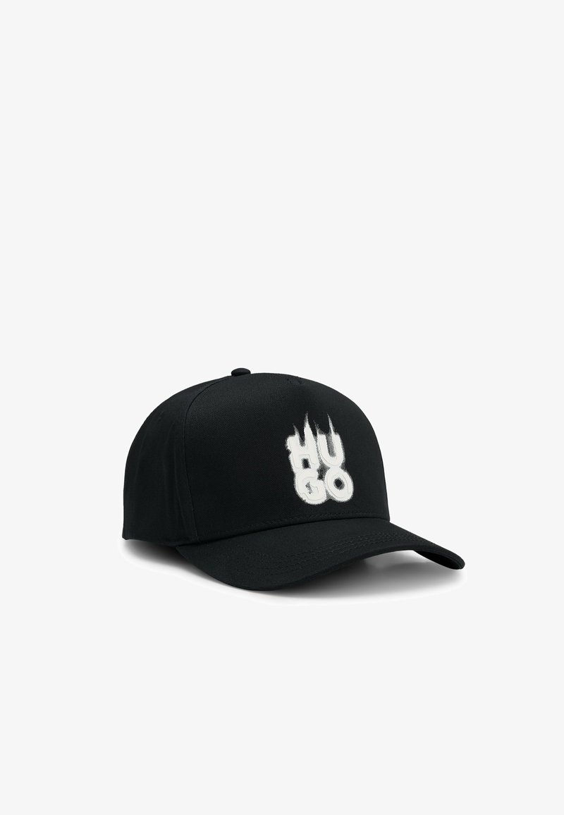 Black baseball cap with a curved brim, featuring a raised white embroidered "HUGO" logo on the front and a textured fabric design.