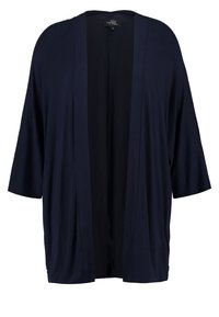 Granatowa kurtka w stylu kimono z szerokimi, krótkimi rękawami, otwartym przodem i miękkim, lekkim materiałem. Charakteryzuje się gładką fakturą i luźnym krojem.