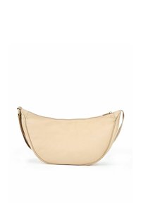 Beżowa skórzana torba na ramię o zakrzywionym, półksiężycowym kształcie. Posiada zamek błyskawiczny oraz jeden regulowany pasek do noszenia. Gładka tekstura.