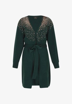 Tummanvihreä neuletakki, jossa on syvä V-pääntie, koristeltu metallinhohtoisilla helmiä olkapäillä, ja siinä on solmittava vyö sekä ribattu hihansuu.