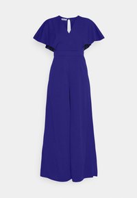 Mono violeta con mangas de vuelo, escote en V y espalda con ojal. Presenta una cintura ajustada y pantalones de pierna ancha. Textura suave.