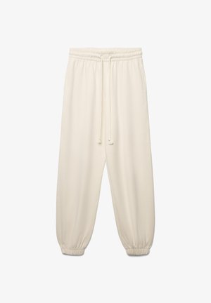 Pantalon de jogging couleur crème en tissu doux, doté d'une taille élastiquée avec un cordon de serrage et de poignets effilés.