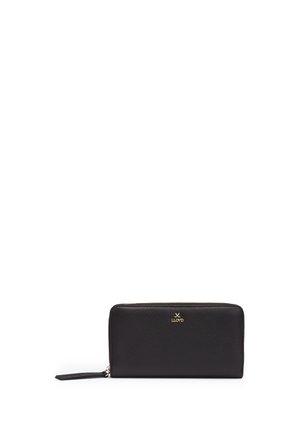 Black leather zip-around wallet with gold logo and wrist strap on a white background.