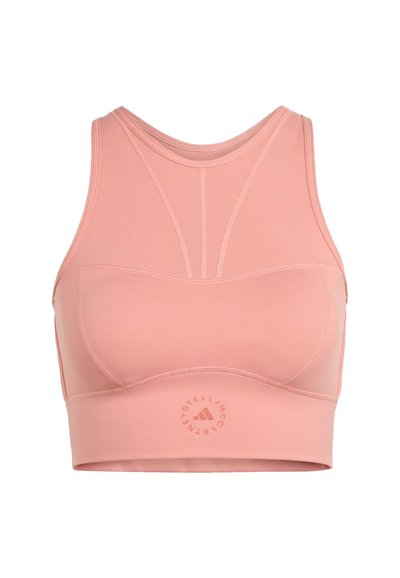 Pink high-neck sports bra with stitched detailing and a small circular logo at the bottom center front.
